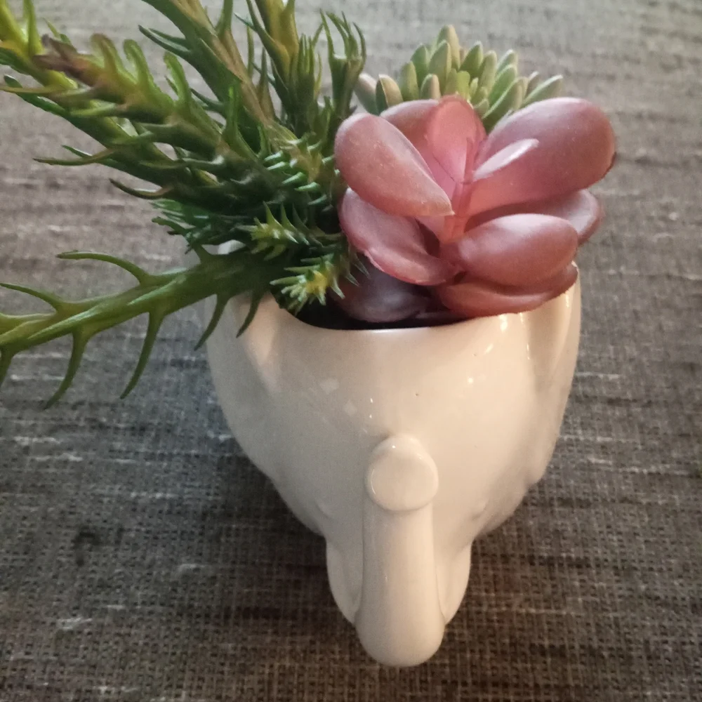 New elephant with faux plant